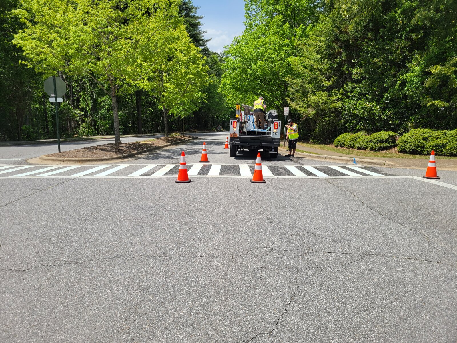 City of Asheville Traffic Engineering crews install a high-visibility crosswalk at Pinchot Drive and Red Fox Circle, May 2026