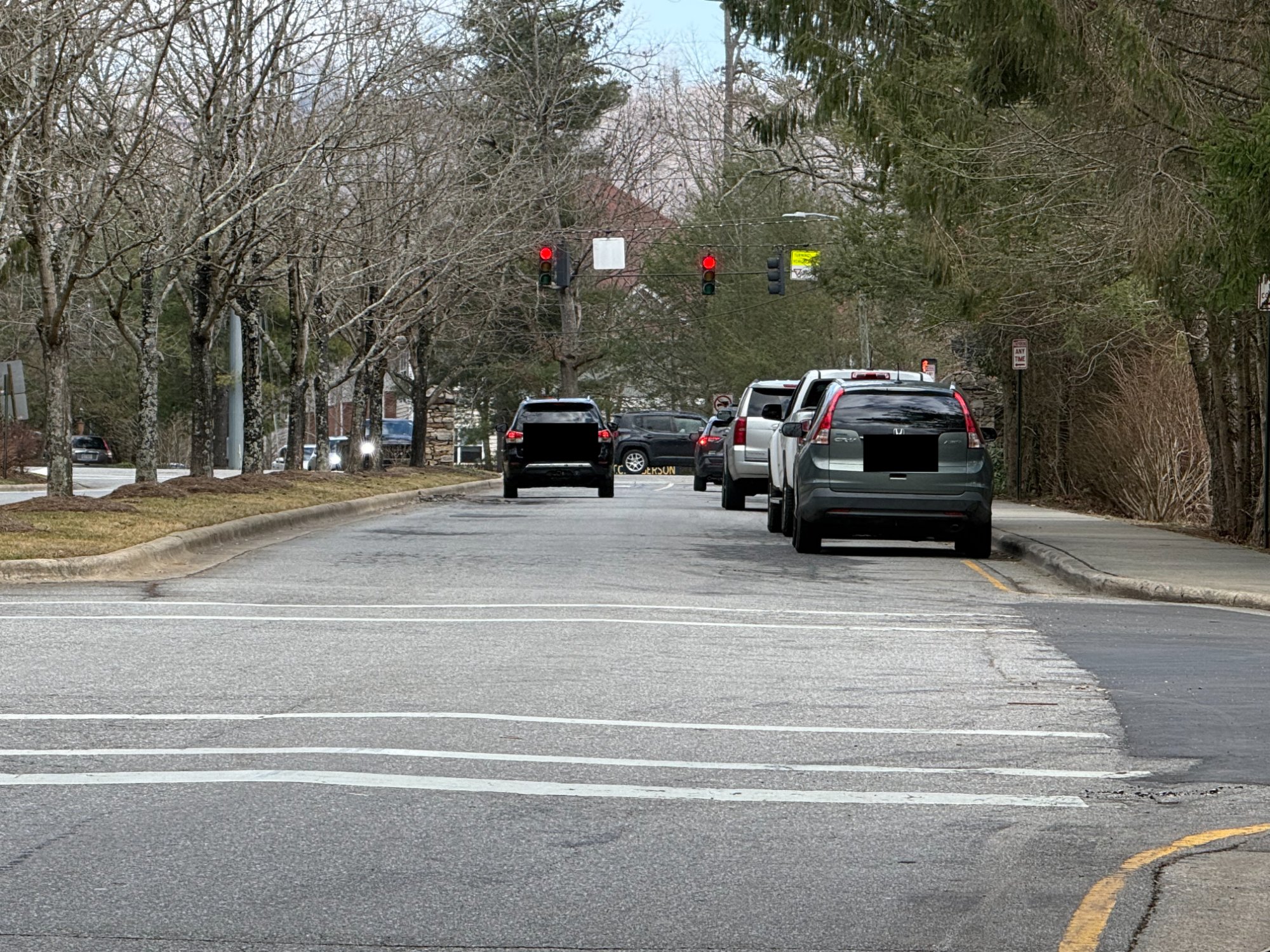 School pickup queue along Pinchot Drive with cars parked on both sides