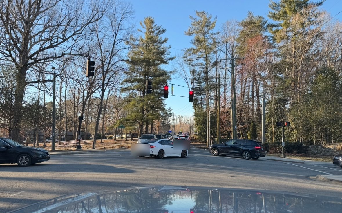 The signalized intersection of Springside Road and Overlook Road with vehicles queued in every direction